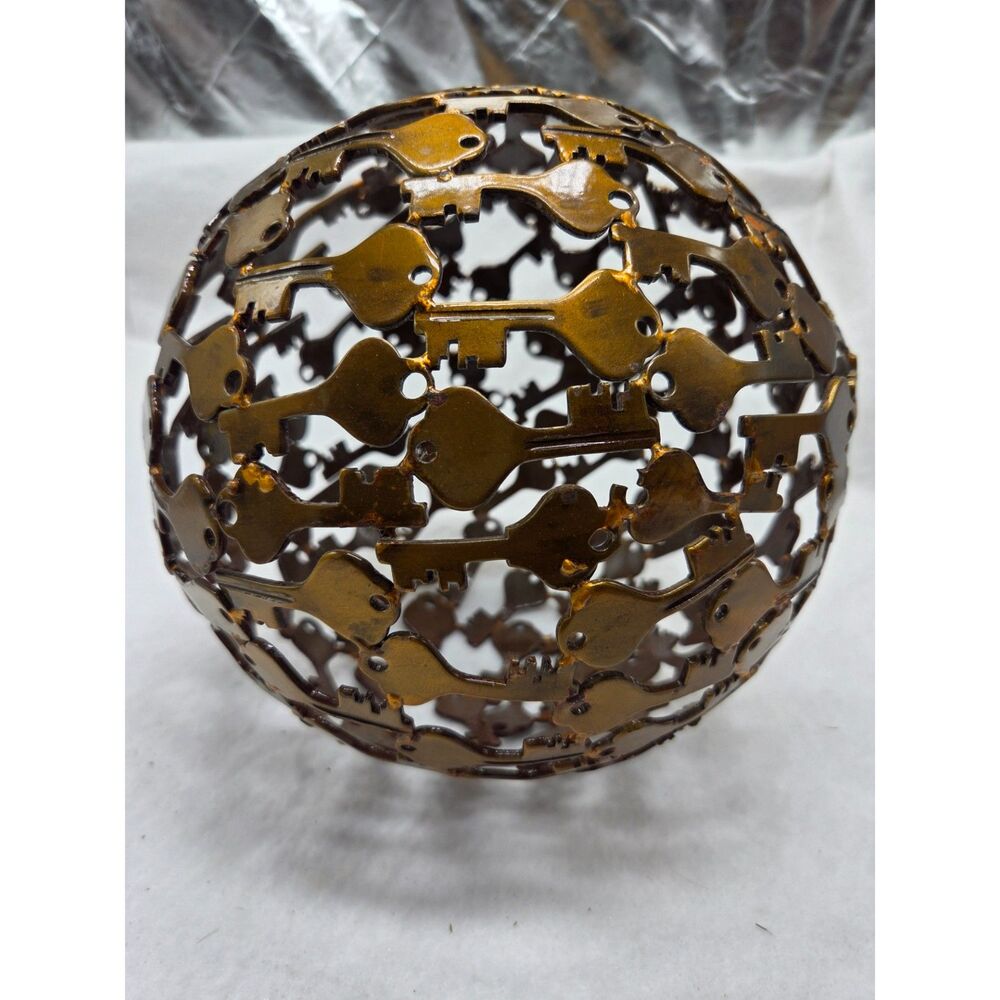 Gold tone metal key sphere/orb sculpture
